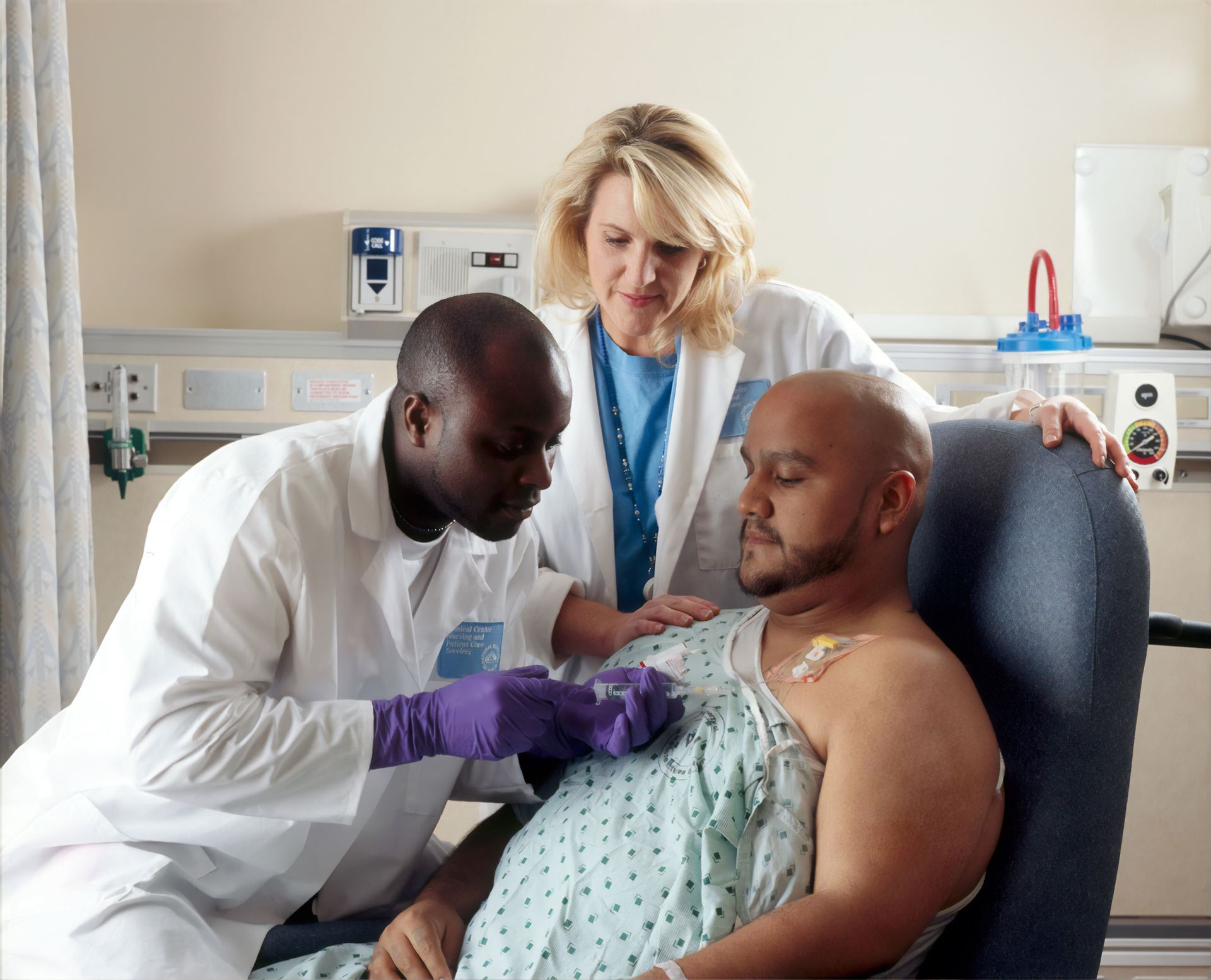 two hospital doctors caring for a patient